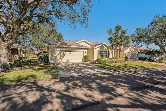 ranch-style house featuring a front yard and a garage