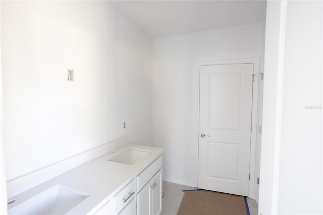 bathroom with double vanity and a sink