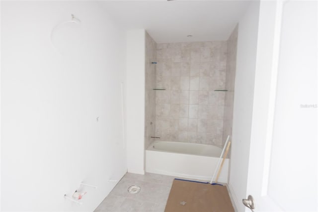 bathroom featuring shower / bath combination, tile patterned flooring, and baseboards