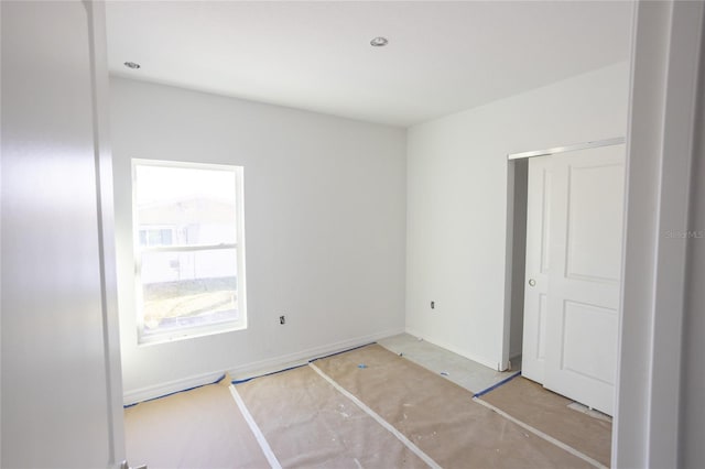 unfurnished bedroom with a closet