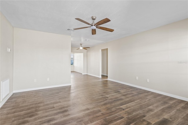 9201 40th Way N, Pinellas Park, FL 33782 - empty room with a ceiling fan and dark wood-style flooring