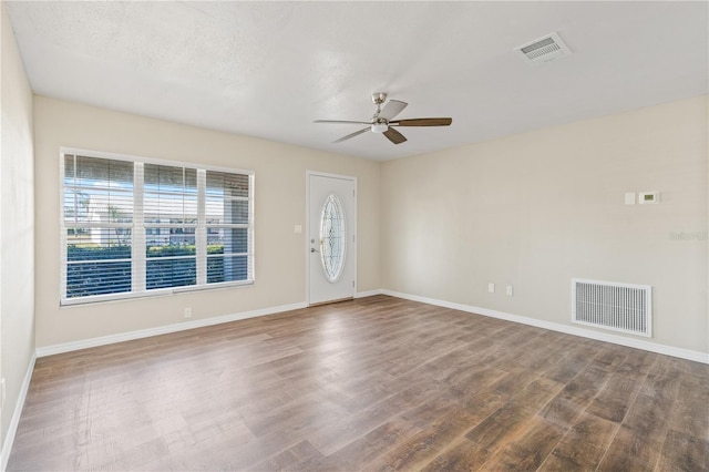 9201 40th Way N, Pinellas Park, FL 33782 - spare room featuring ceiling fan and wood finished floors