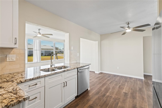 9201 40th Way N, Pinellas Park, FL 33782 - kitchen with stainless steel dishwasher, ceiling fan, dark wood-type flooring, and backsplash
