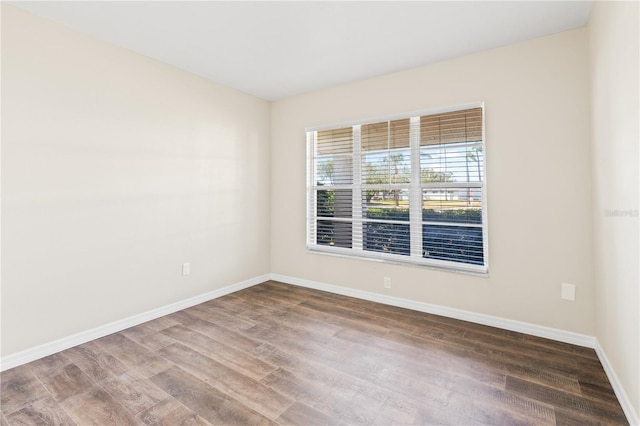 spare room with wood-type flooring