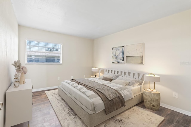 bedroom with hardwood / wood-style floors