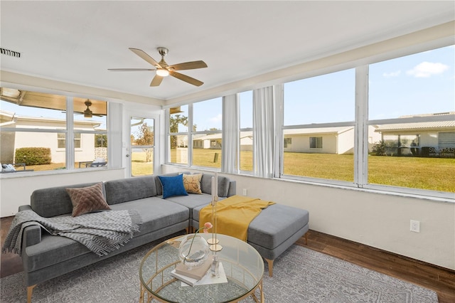 sunroom with ceiling fan