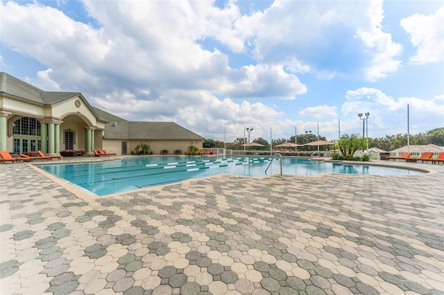 view of swimming pool with a patio area