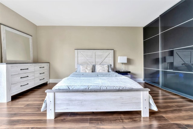 bedroom featuring dark hardwood / wood-style floors