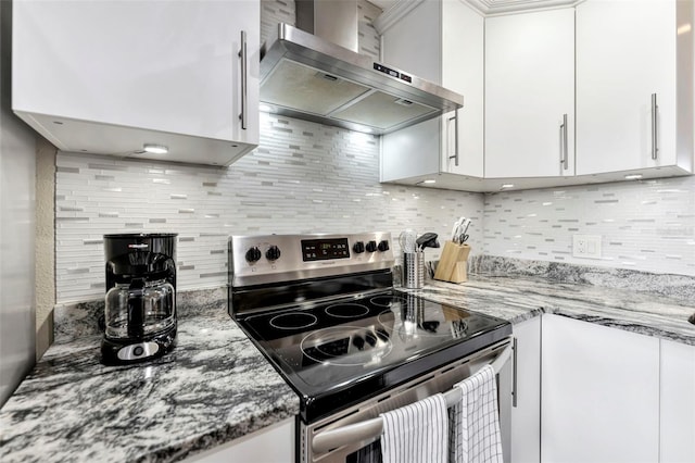 kitchen featuring white cabinets, wall chimney exhaust hood, and stainless steel electric range