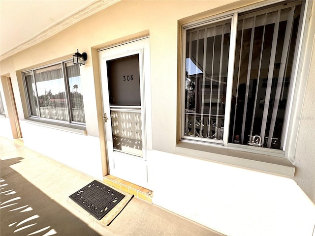1235 S Highland Ave Unit 2-308, Clearwater, FL 33756 - view of exterior entry with stucco siding