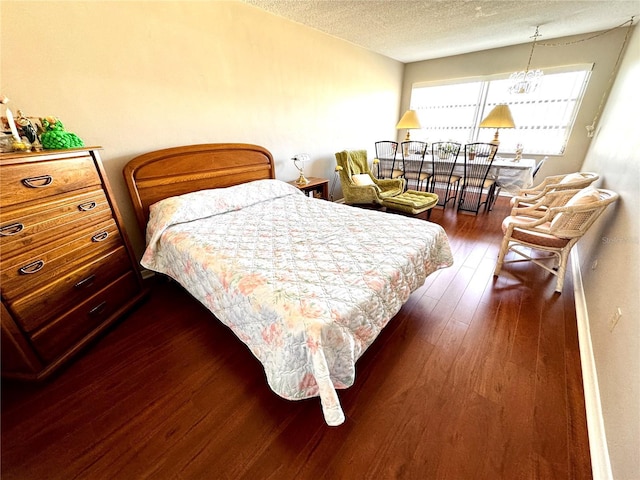 1235 S Highland Ave Unit 2-308, Clearwater, FL 33756 - bedroom with a textured ceiling and dark wood-type flooring