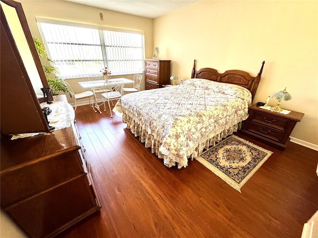 bedroom featuring dark hardwood / wood-style flooring