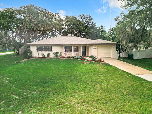 ranch-style house with a garage and a front yard