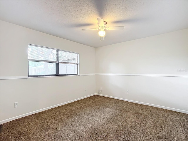 spare room with ceiling fan, carpet floors, and a textured ceiling