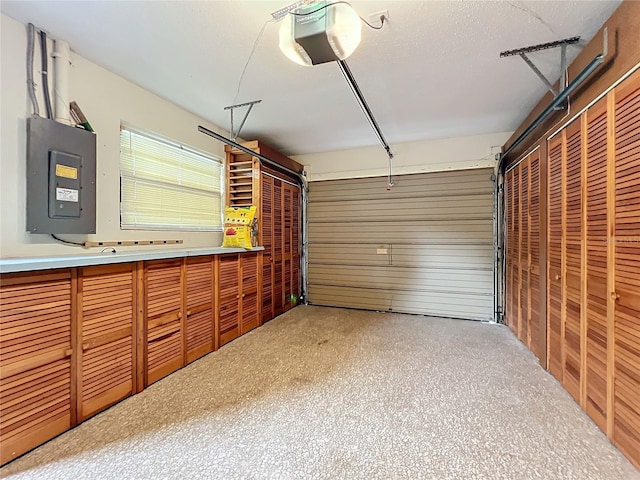 garage with electric panel and a garage door opener