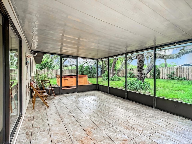 unfurnished sunroom featuring a healthy amount of sunlight