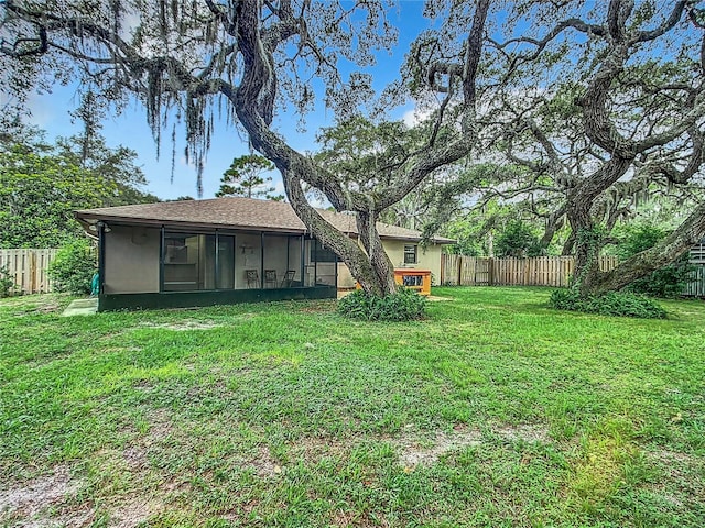 view of yard with a sunroom