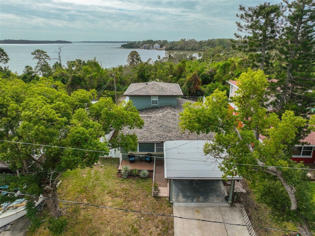 birds eye view of property with a water view