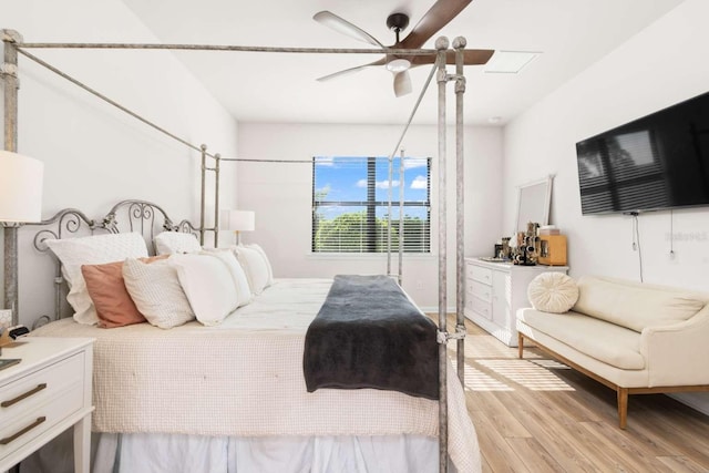 bedroom with light wood-type flooring and ceiling fan