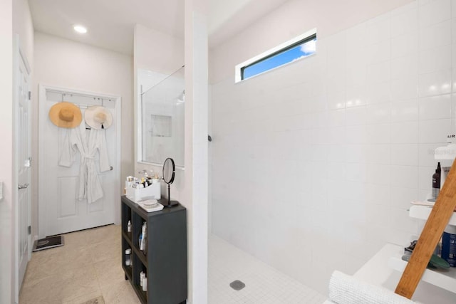 bathroom featuring tiled shower