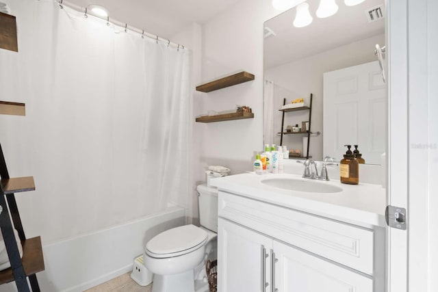 full bathroom featuring vanity, shower / tub combo, and toilet