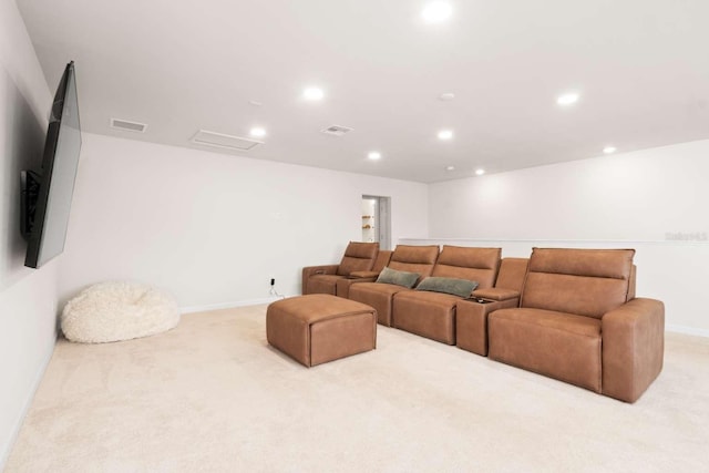 cinema room featuring light carpet