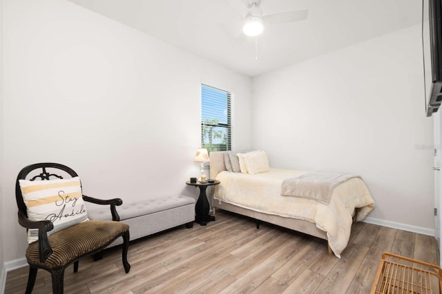 bedroom with ceiling fan and light hardwood / wood-style floors