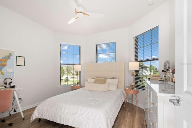 bedroom featuring ceiling fan and dark hardwood / wood-style flooring