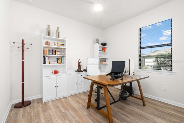 office with light wood-type flooring