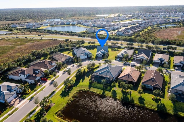 bird's eye view with a water view