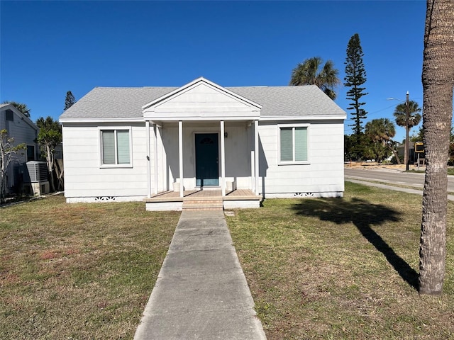 bungalow-style home with a front lawn