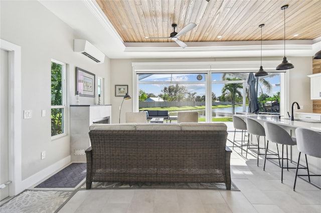 living room featuring wood ceiling, a raised ceiling, a wall unit AC, ceiling fan, and a water view