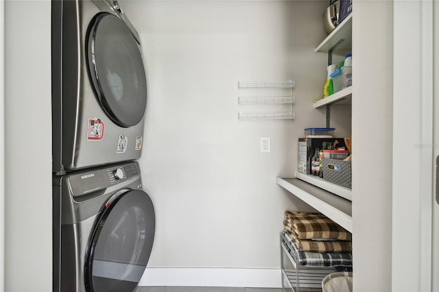 laundry area with stacked washer / drying machine