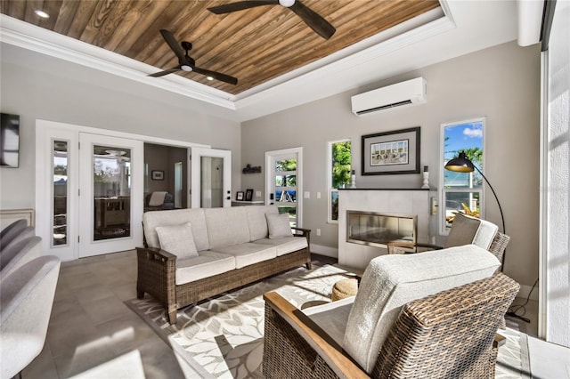 living room with a fireplace, wood ceiling, crown molding, and an AC wall unit