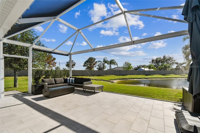 view of patio featuring a water view, glass enclosure, and an outdoor living space with a fire pit