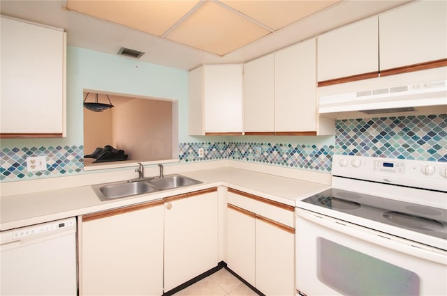 kitchen featuring white cabinets, decorative backsplash, white appliances, and sink