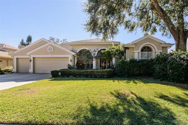 view of front of house featuring a front yard and a garage