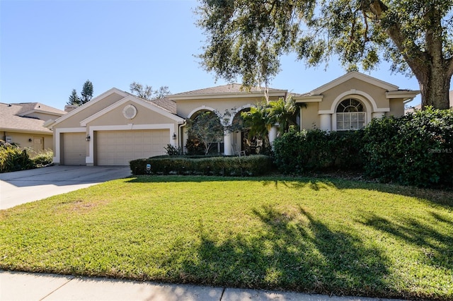 ranch-style house featuring a garage and a front lawn