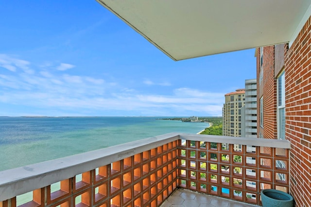 balcony featuring a water view