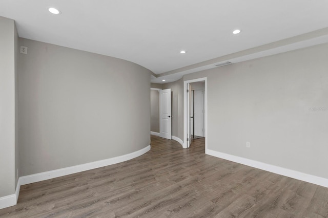 unfurnished room with light hardwood / wood-style flooring