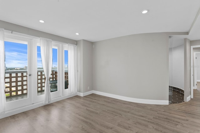 unfurnished room featuring hardwood / wood-style flooring