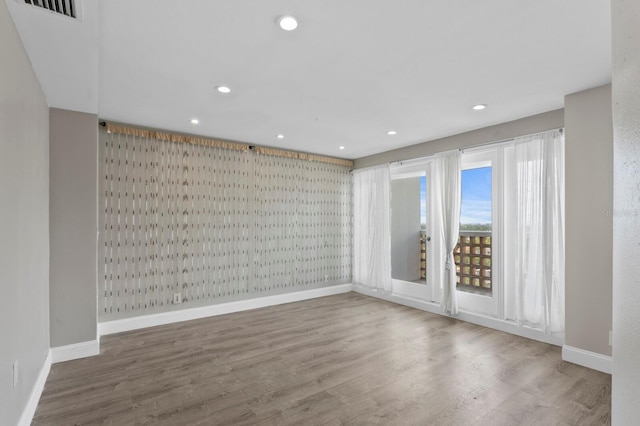 4015 Bayshore Blvd Unit 16A, Tampa, FL 33611 - empty room with baseboards, recessed lighting, and wood finished floors