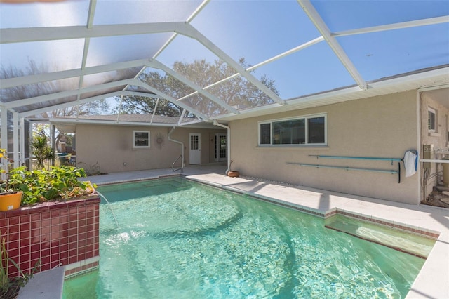 view of pool featuring a patio, a lanai, and pool water feature