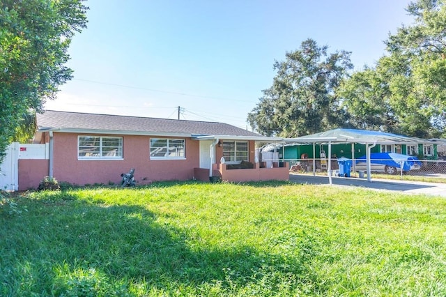 single story home featuring a front yard