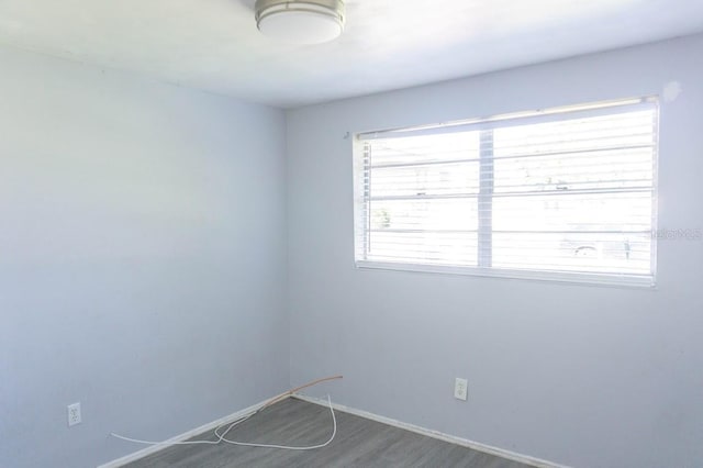 spare room with hardwood / wood-style floors