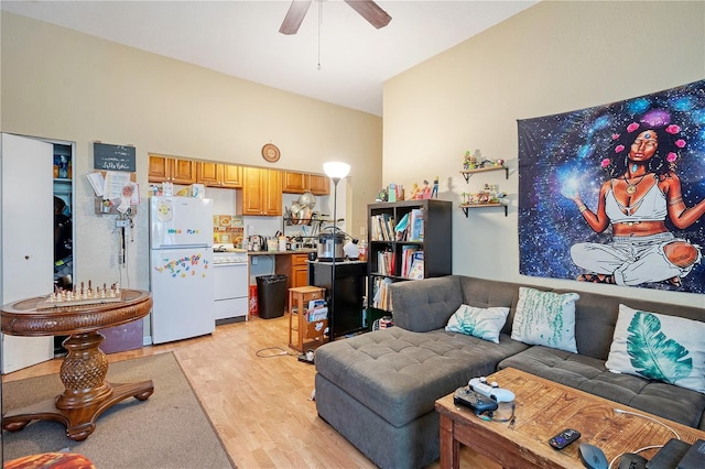 living room with ceiling fan and light hardwood / wood-style floors