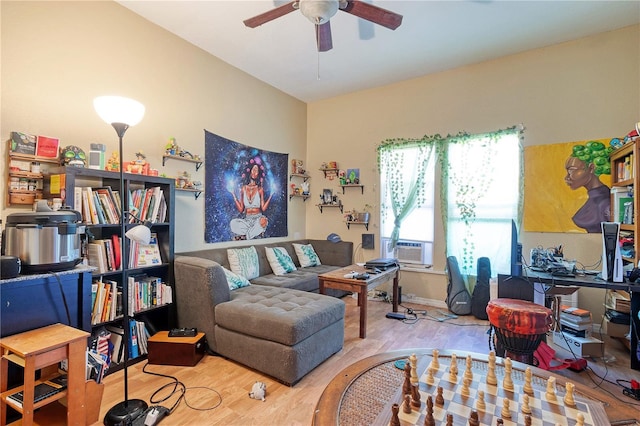 living room with ceiling fan and hardwood / wood-style flooring