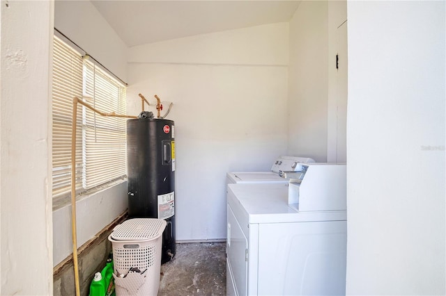 washroom with washing machine and dryer and water heater