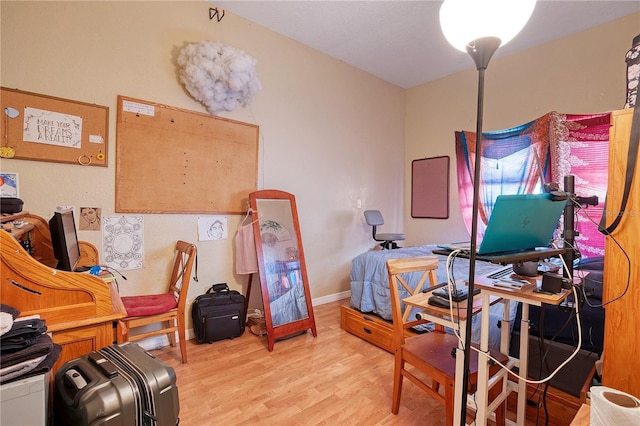 office with light hardwood / wood-style flooring