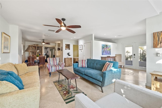 living room featuring ceiling fan and french doors